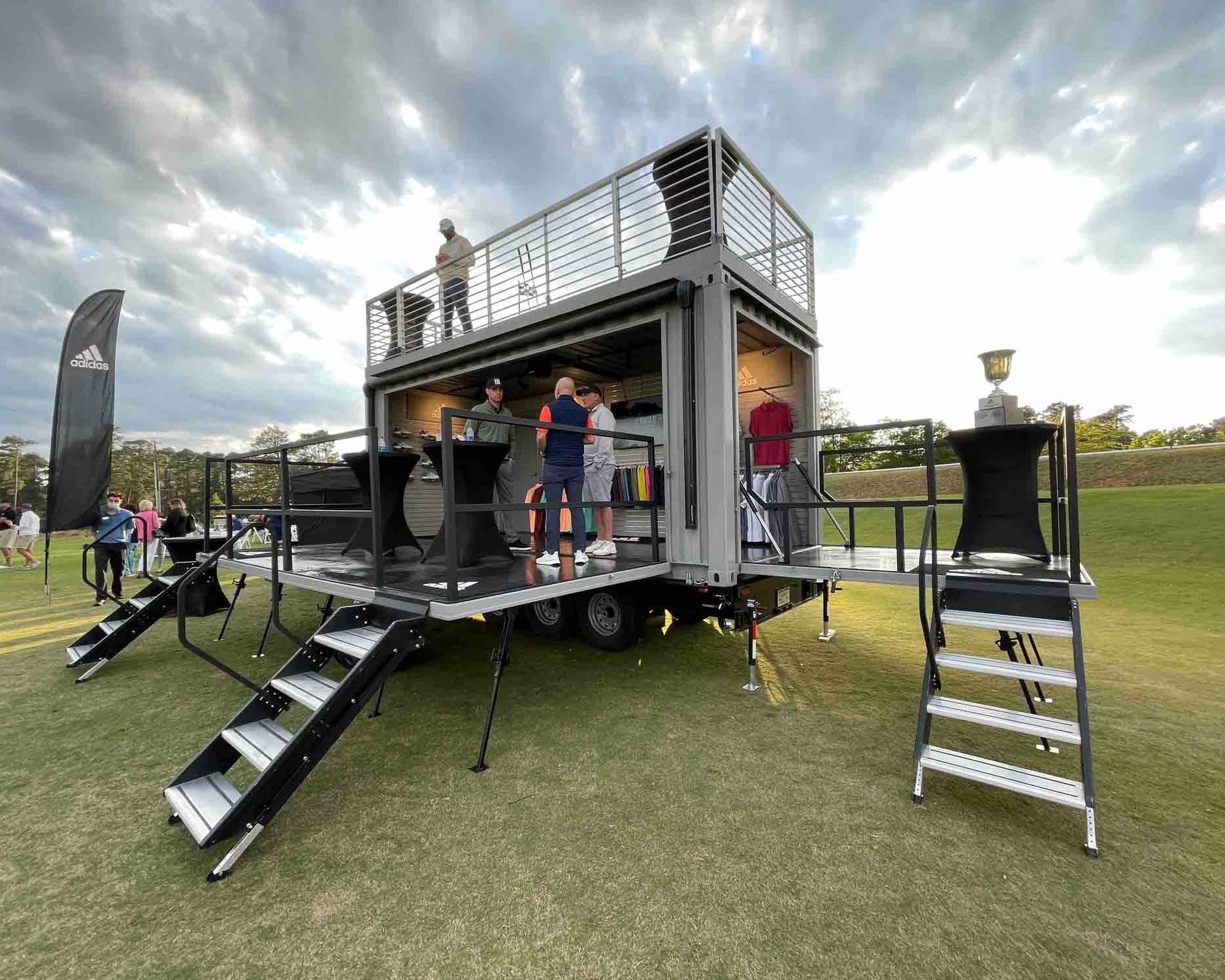 Front view of the staircase to the rooftop deck of ROXBOX Containers' custom Adidas Golf PGA Tour shipping container mobile experiential marketing activation.