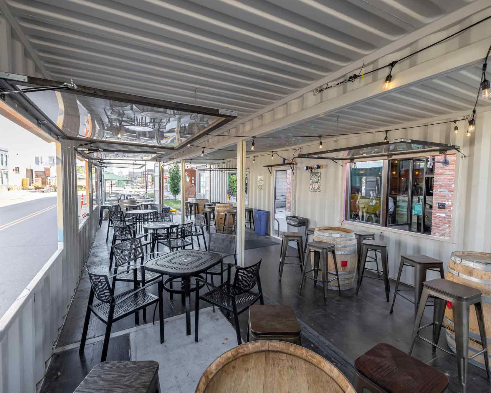 Inside Odell Brewing Co.'s custom shipping container patio in the RiNo Art District of Denver, Colorado, built by ROXBOX Containers.